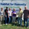 Benzie County's 100+ Women Who Care recentely made a $14,900 donation to Habitat for Humanity of Benzie County. Pictured (from left) are Habitat for Humanity board members Jackie Luedtke-Borozan, Steve VanDePere and Pastor Patty Higgins; JoAnn Holwerda, of 100+ Women Who Care; Glen Tracy, Habitat for Humanity president; and William Merry, Habitat for Humanity executive director.