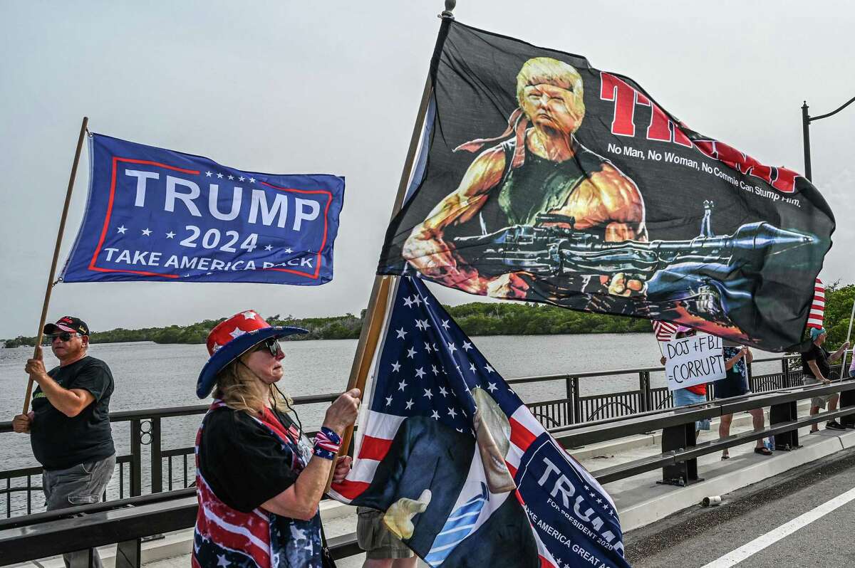 Supporters of former President Donald Trump gather near his residence at Mar-a-Lago in Palm Beach, Fla., on Aug. 9, after the FBI removed boxes of documents from the private resort.