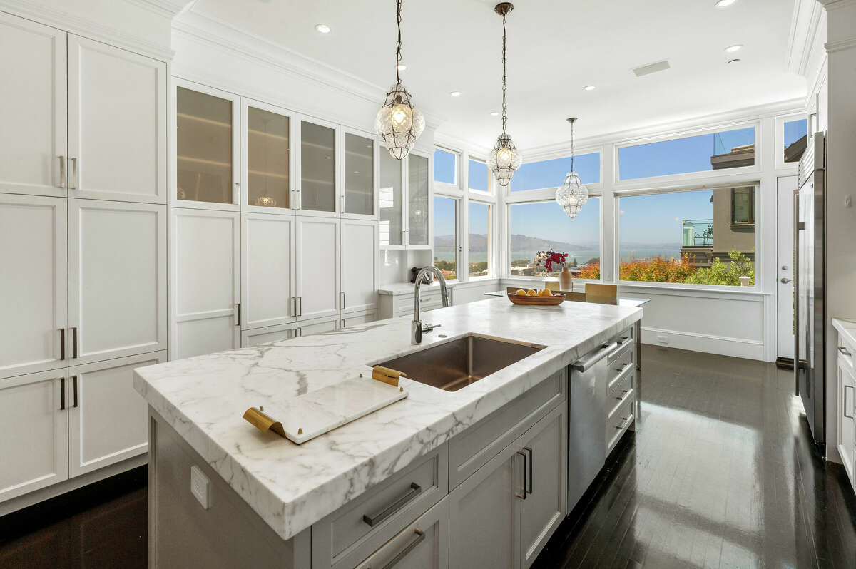 The kitchen is full of high-end appliances.