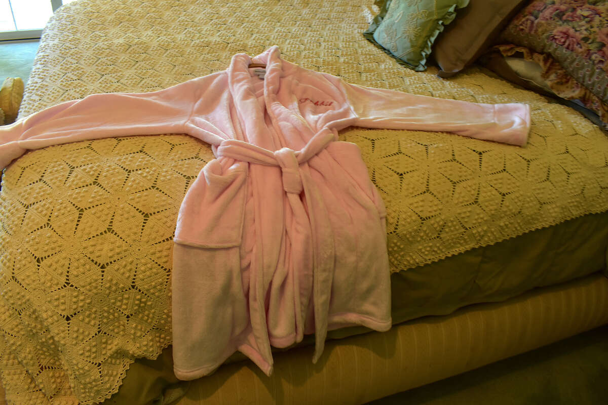 One of Debbie Reynolds' robes displayed on the bed she slept in while staying at her family's 44-acre Central Coast ranch in Creston, Calif. 