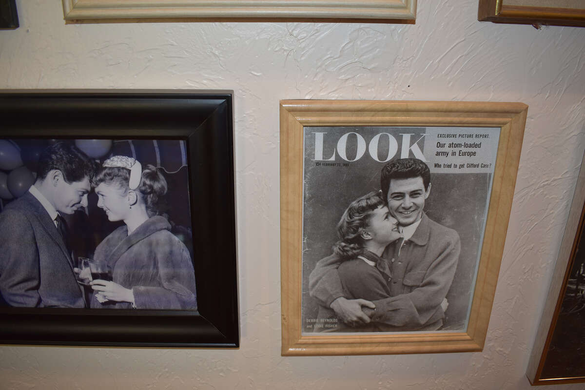 A picture and magazine cover of the courtship of Debbie Reynolds and Eddie Fisher hangs in the hallway of son Todd Fisher's 44-acre ranch in Creston, Calif. 
