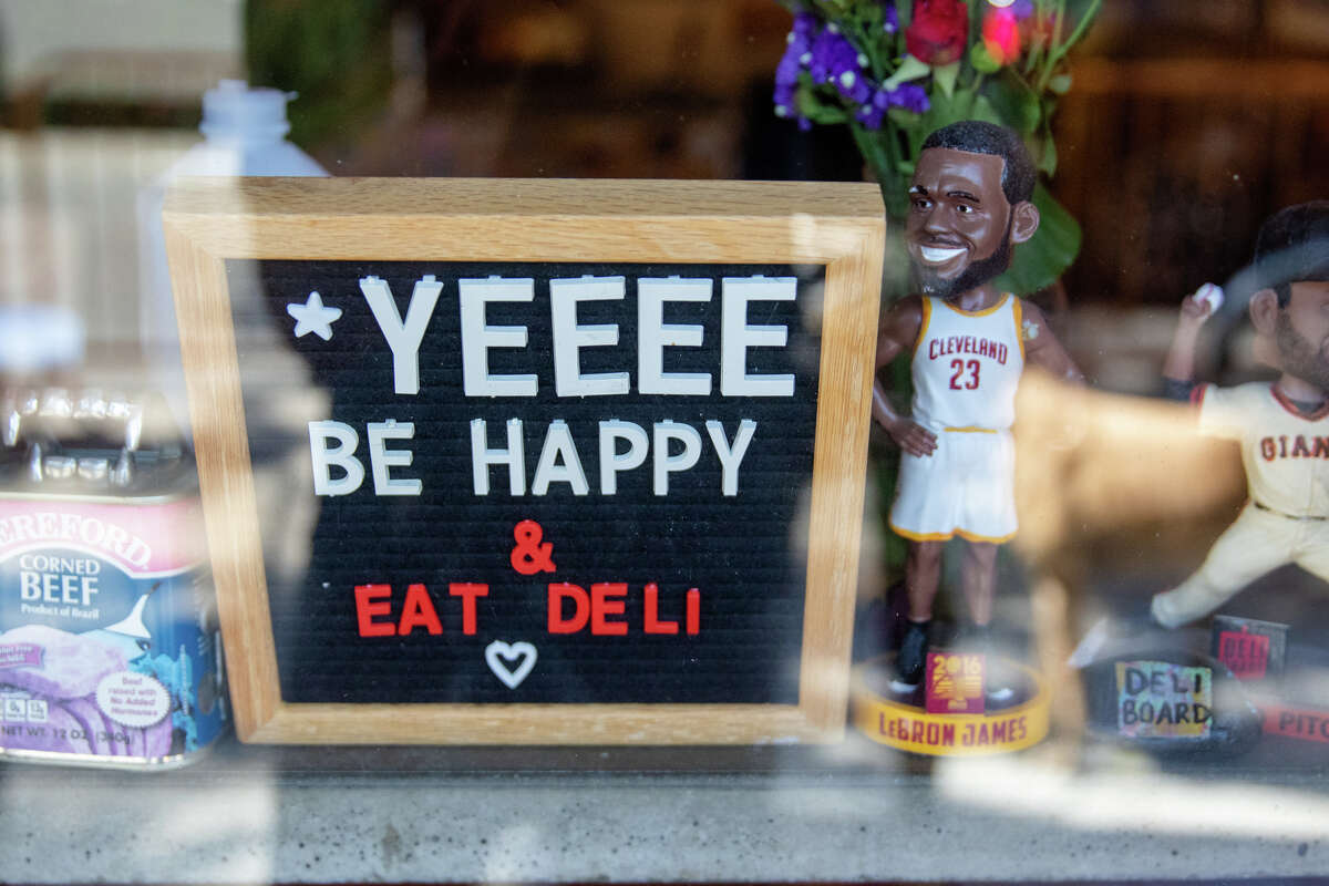 One of the sign boards carries a message with bobble head figurines of LeBron James and Giants players at Deli Board in San Francisco, Calif. on Aug. 19, 2022.