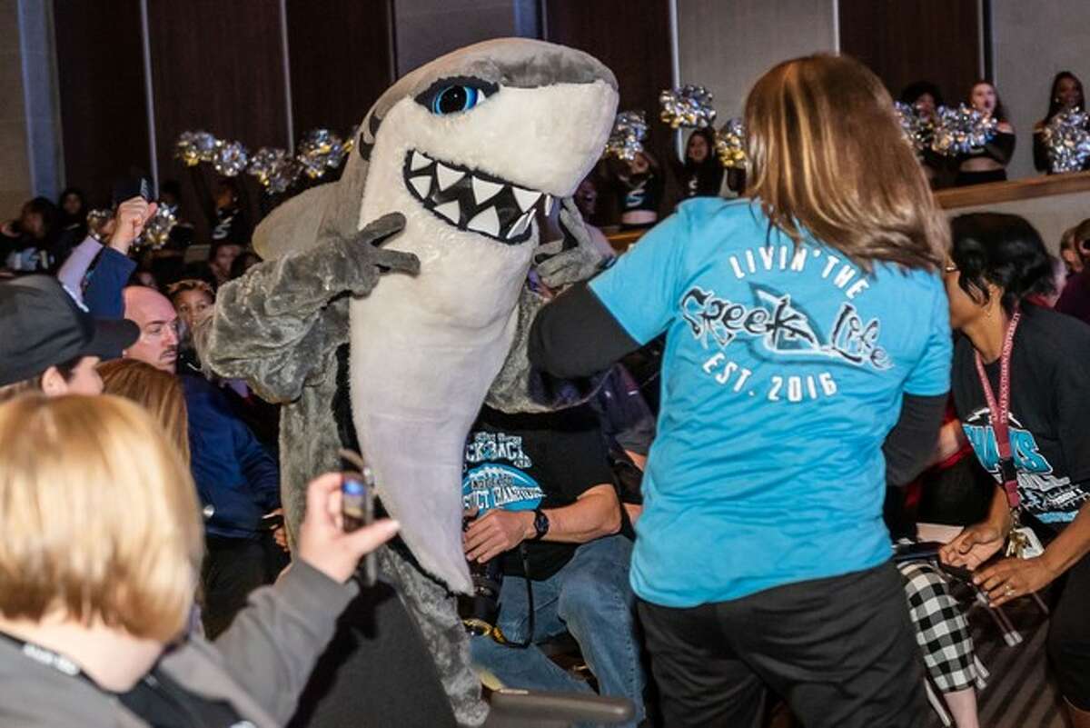 The principals of Shadow Creek and Manvel high schools made a friendly bet before the first-ever football contest between the Sharks and the Mustangs on Aug. 26. One possible outcome is that the losing team's principal must sing the winner's alma mater over the victor's public address system while wearing the head of that school's mascot costume.