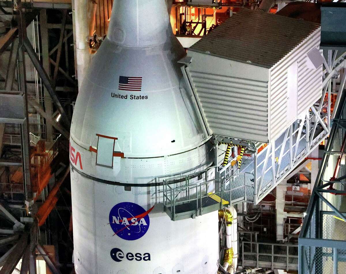 Artemis I and the Orion spacecraft shortly before rollout to the launch pad —as seen from the high bay level inside the Vehicle Assembly Building— at Kennedy Space Center, Florida, Launch Complex 39, Tuesday, Aug. 16, 2022. Artemis I is scheduled to launch on an unmanned mission to orbit the moon on Aug. 29. (Joe Burbank/Orlando Sentinel/TNS)