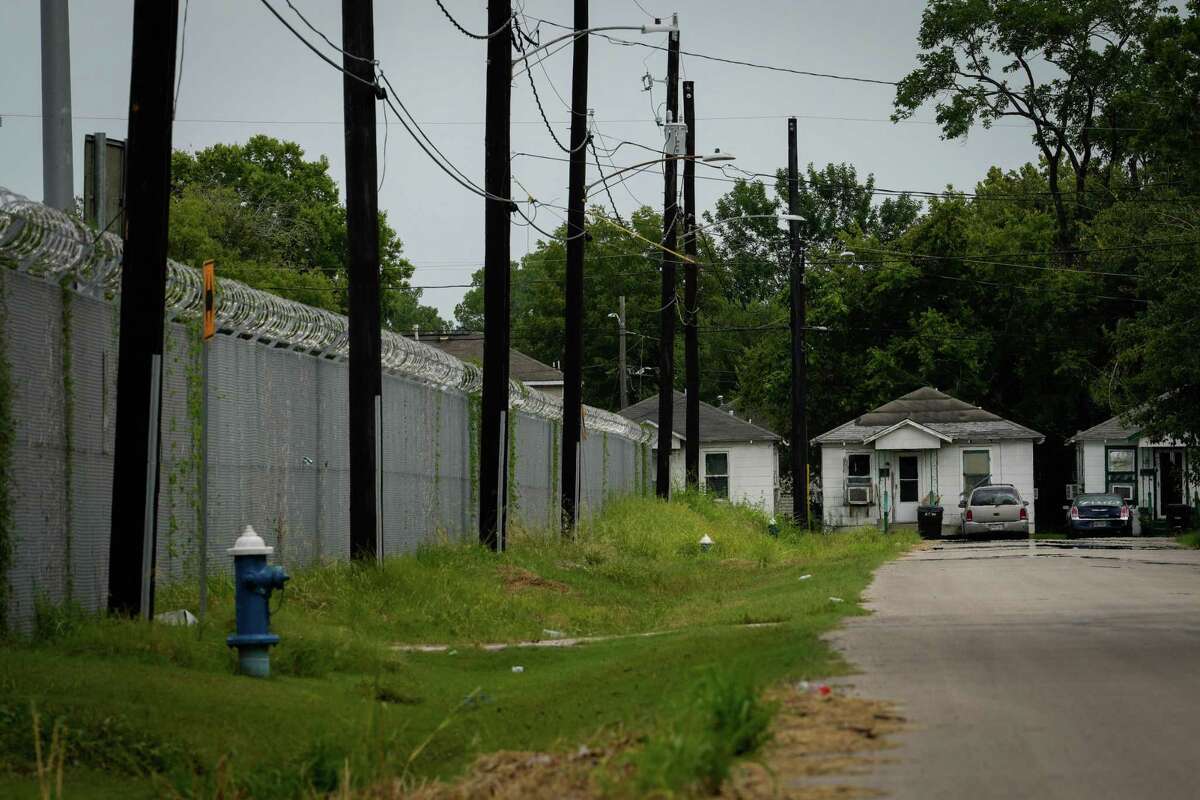 Homes sit just outside Union Pacific’s Englewood rail yard Friday, Aug. 12, 2022, in Houston. Authorities have identified higher rates of cancer than expected in Fifth Ward around the rail yard.