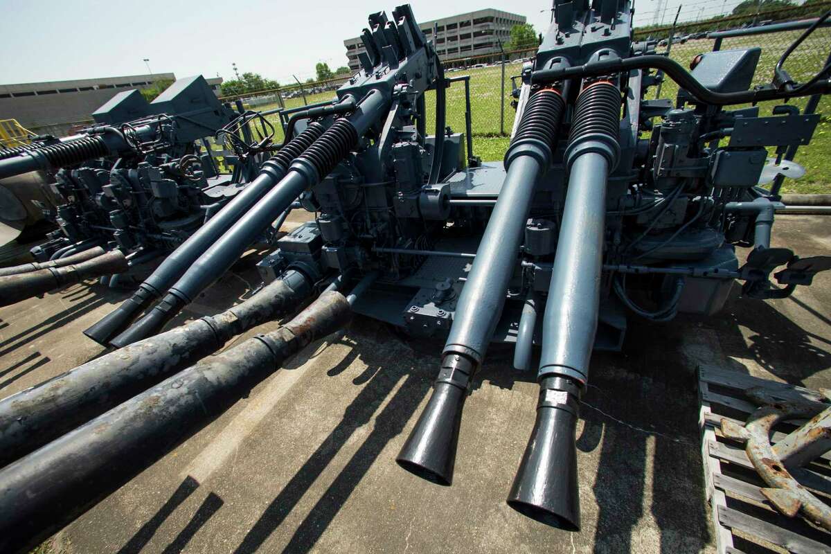 The Battleship Texas' anti-aircraft guns are stored outside an NRG warehouse waiting to be restored on April 21, 2021 in La Porte.  The Battleship Texas has been undergoing extensive renovations since it closed to the public in early 2020.
