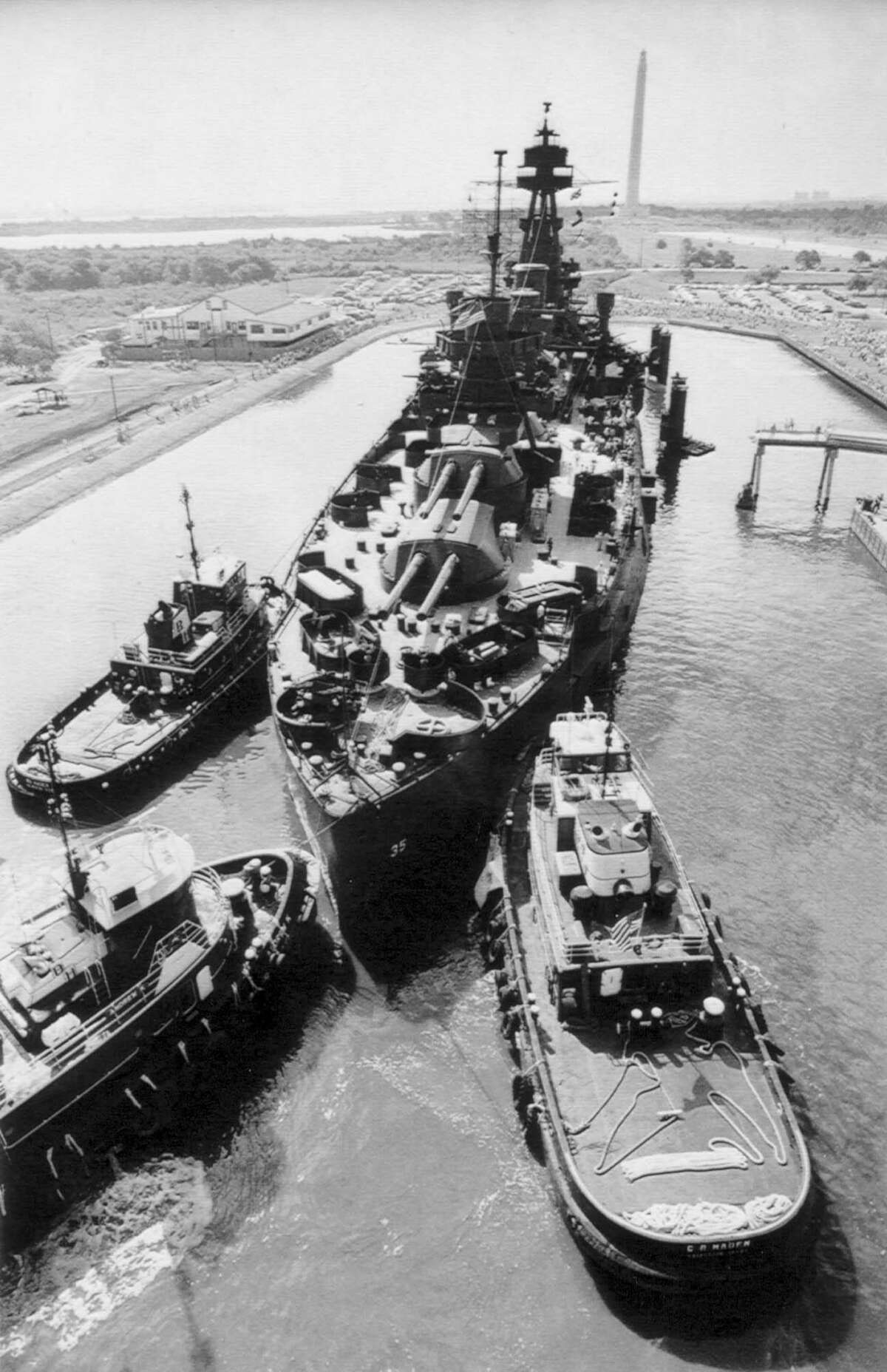 The restored Battleship Texas is returned to its permanent berth at San Jacinto State Park on July 26, 1990, after spending a year and a half in dry dock in Galveston for a $14 million face-lift.