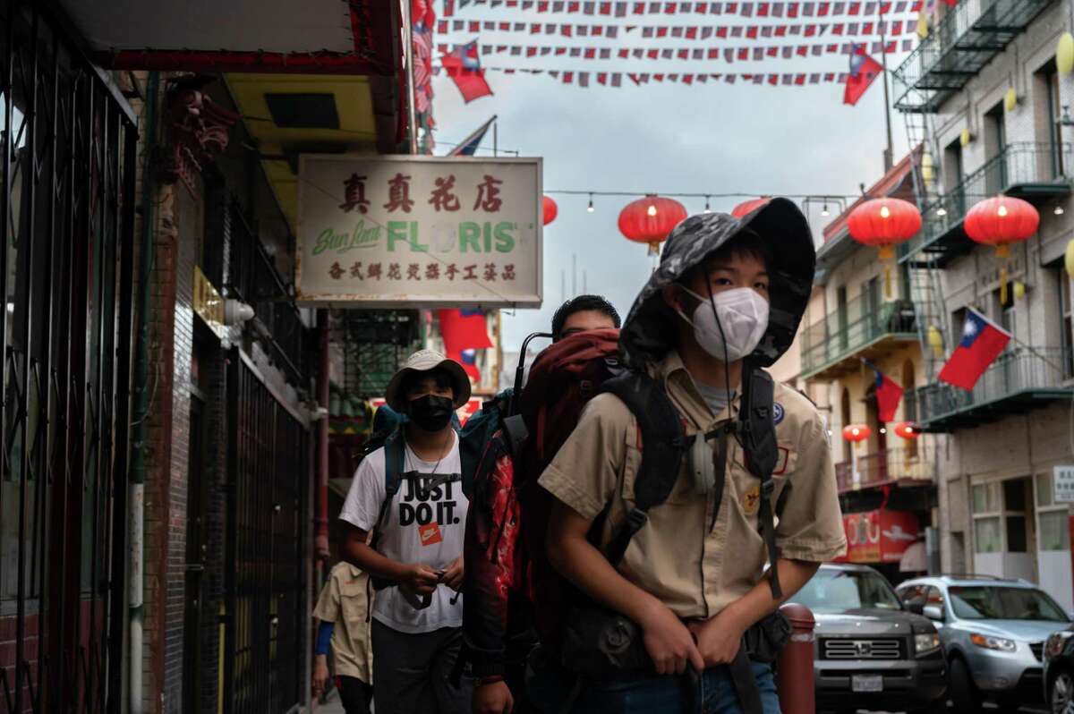 Members of Boy Scout Troop 3 hike around San Francisco’s Chinatown earlier this month as a shakedown in preparation for a backpacking trek around Lake Tahoe.