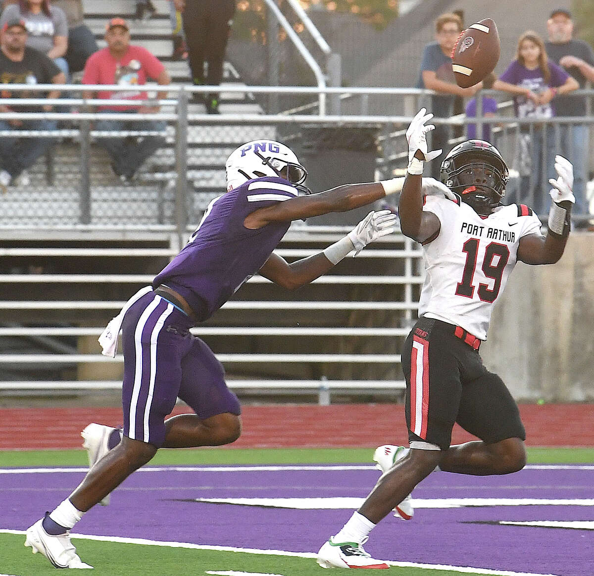 Port Neches-Groves' Torryann Hinton pushes Port Arthur Memorial's #19 as he tries to complete the pass for the touchdown during their season opener Friday. Photo made Friday, August 26, 2022 Kim Brent/Beaumont Enterprise