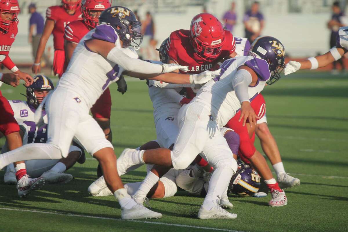 The LBJ Wolves opened their season with a 14-7 win over the Martin Tigers Friday.