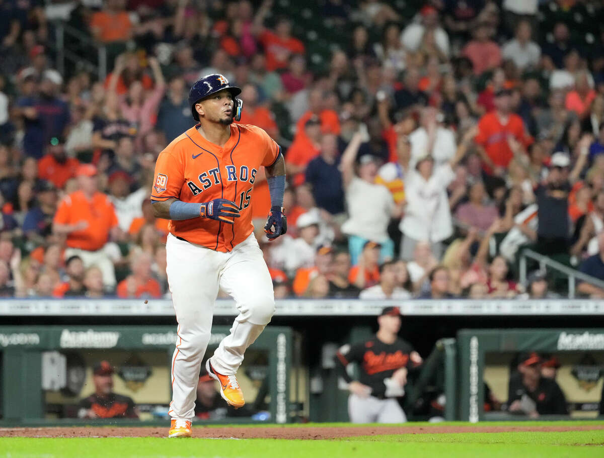 Houston Astros catcher Martin Maldonado (15) hits a home run in