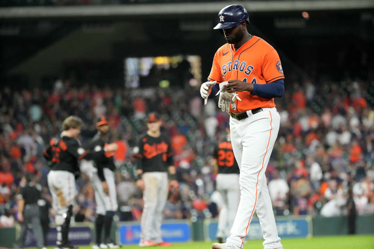 Houston Astros' Yordan Alvarez (44) walks back to the dugout after Trey Mancini (26) stuck out to end a MLB baseball game at Minute Maid Park on Friday, Aug. 26, 2022 in Houston. Astros lost 2-0.