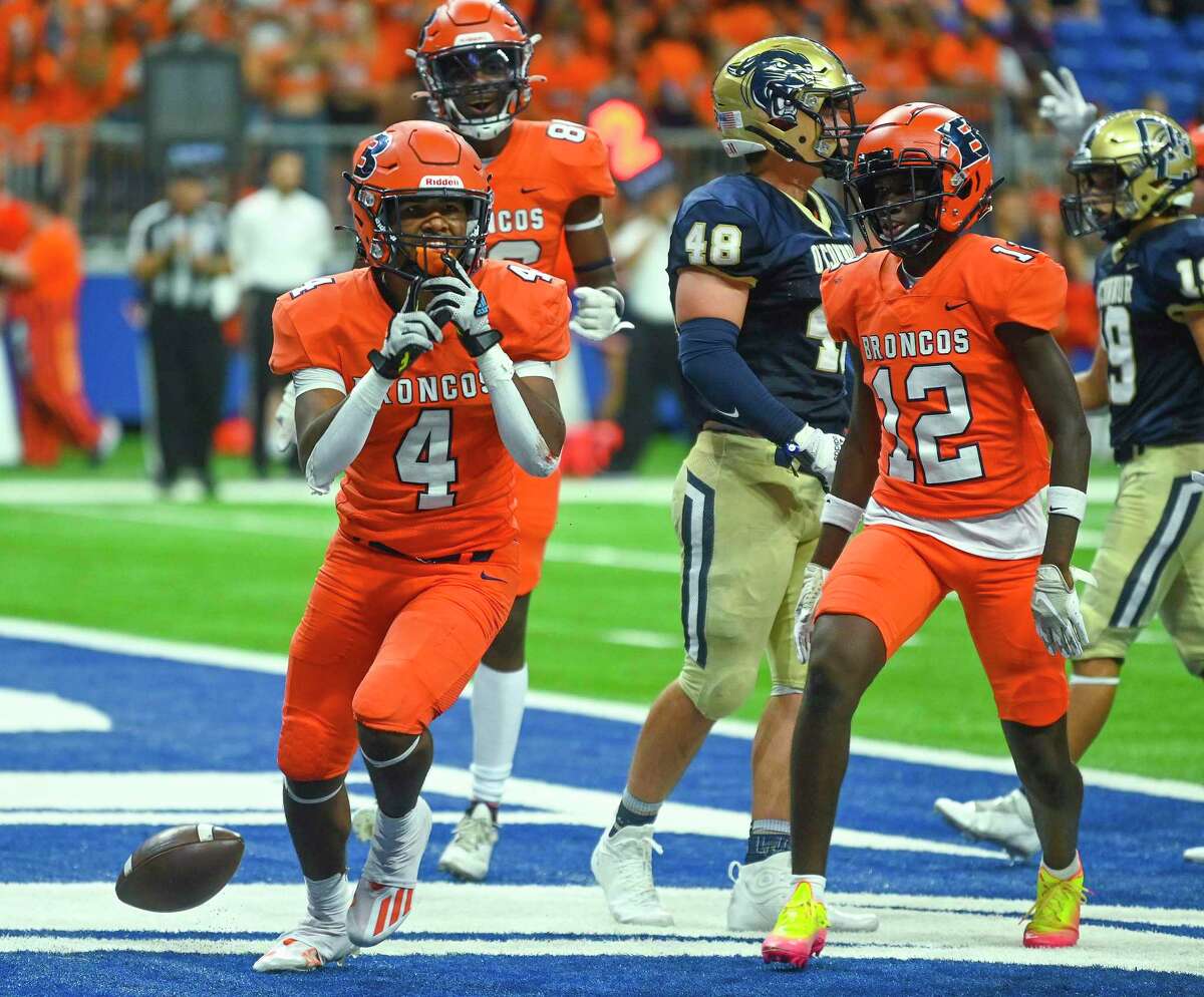 Running back Joseph Coleman of Brandeis celebrates after scoring against O’Connor during high school football action in the Alamodome on Friday, Aug. 26, 2022. Brandeis won, 27-17.