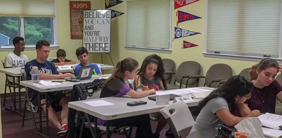 A tutoring session of the Beyond Limits Academic Program, a program of the Stamford Peace Youth Foundation.
