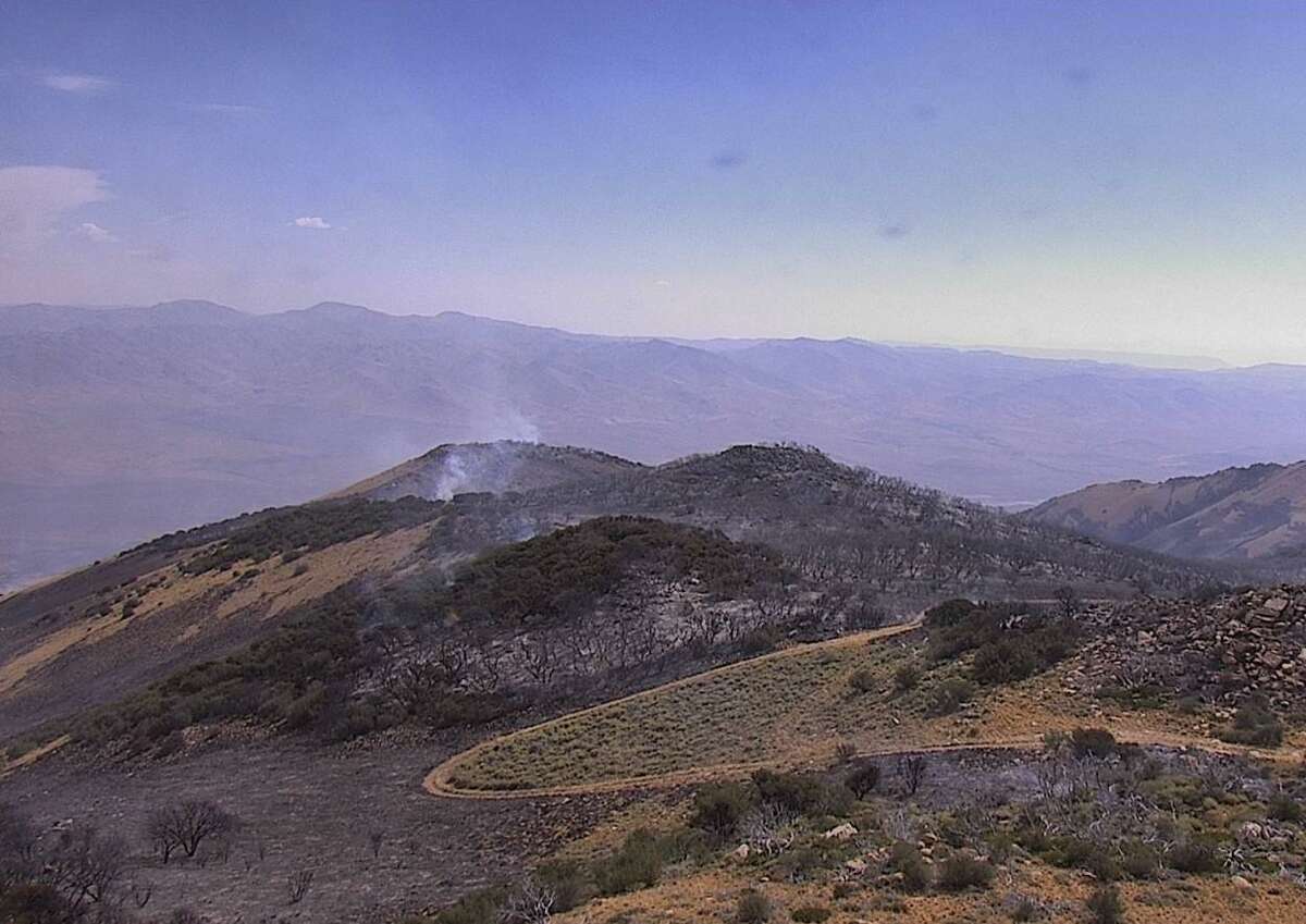 A view from the AlertWildfire Alta Peak webcam on the morning of Saturday, Aug. 27 shows the scarred path of the Cherry Gulch Fire.