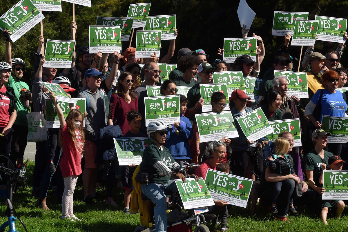 Supporters of Proposition J gather for a group photo during a rally in support of the ballot measure in Golden Gate Park on Saturday. 