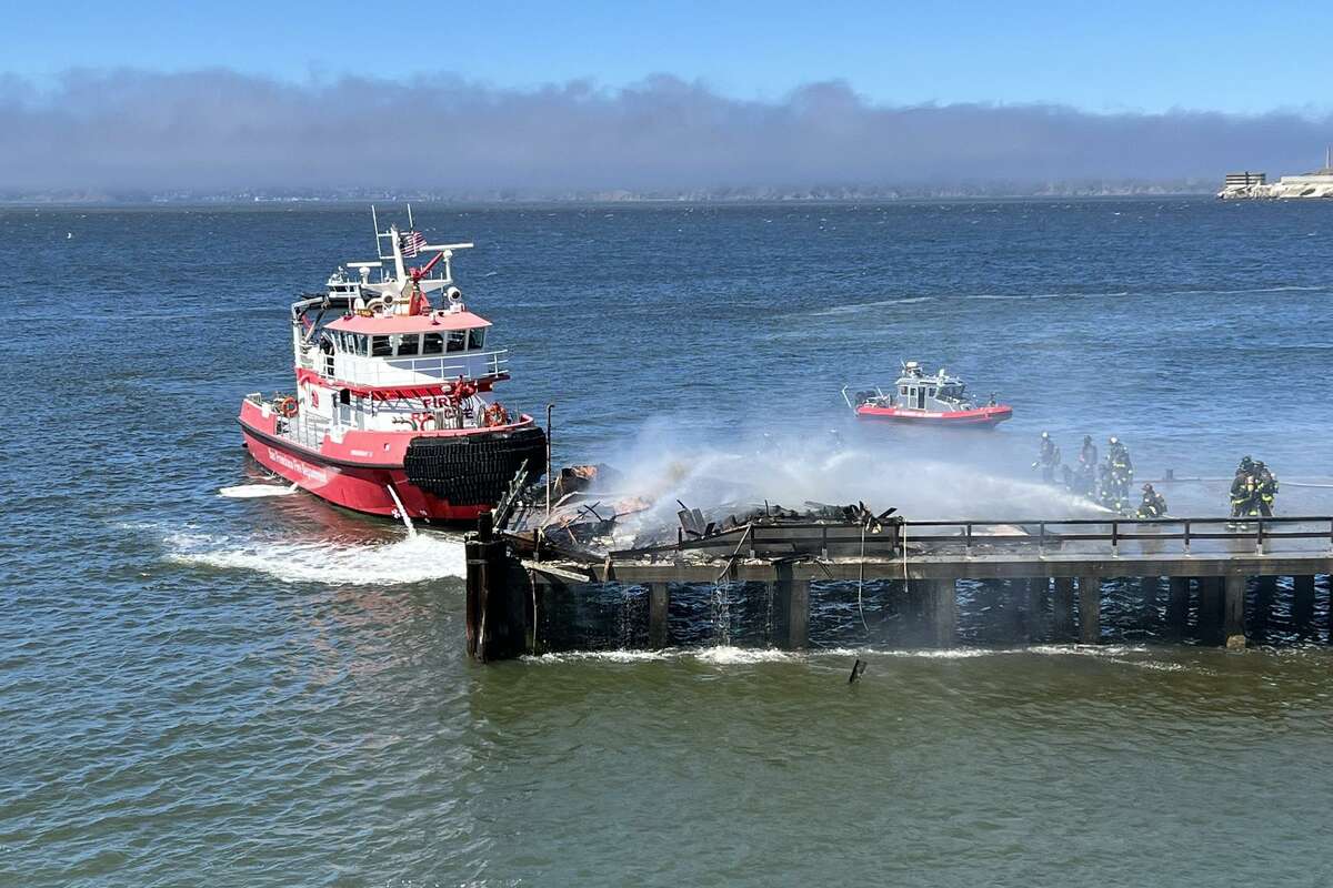 Firefighters extinguish the blaze at Fort Mason Pier 4.