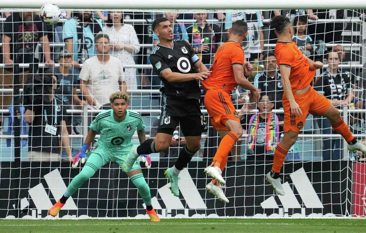 Minnesota United defender Michael Boxall (15) clears away a corner kick from the Houston Dynamo during the first half of an MLS soccer game Saturday, Aug. 27, 2022 at Allianz Field in St. Paul, Minn. (Anthony Souffle/Star Tribune via AP)