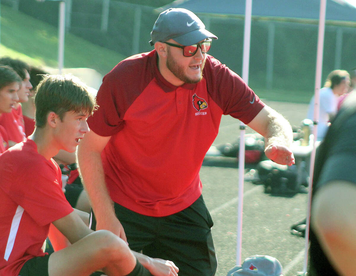 Tyler Hamilton has stepped down as Alton High boys soccer coach after three seasons. He is shown giving instructions to his team during a game last season at Public School Stadium.
