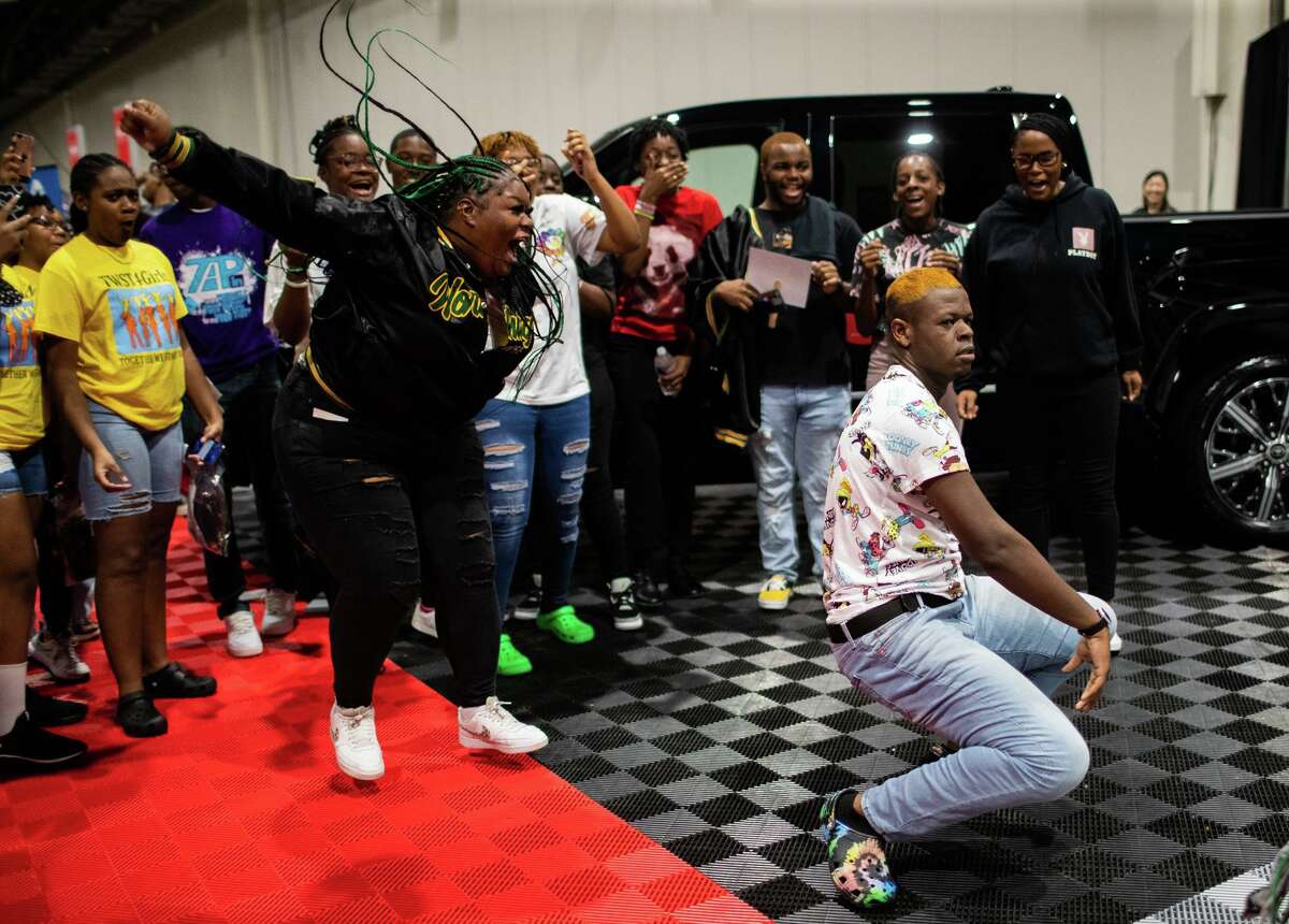 Worthing High School senior Jmichael Holiday, right, 17, step-dances in a friendly competition at the HBCU S.T.E.M. College Recruitment Fair at the NRG Center, Saturday, Aug. 27, 2022, in Houston.