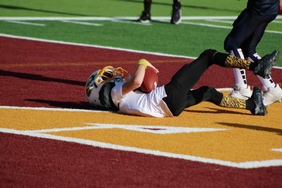Tigers receiver Caleb Hoffpauir lies in the end zone, cradling a fourth-quarter touchdown reception that would be the team's only touchdown on the day.