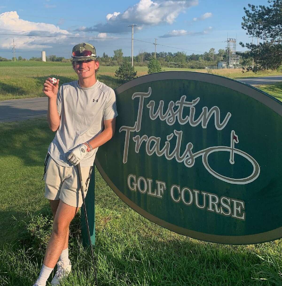 Pine River senior Austin Dean holds the ball which he used to shoot a double eagle at Tustin Trails Golf Course on Aug. 16.