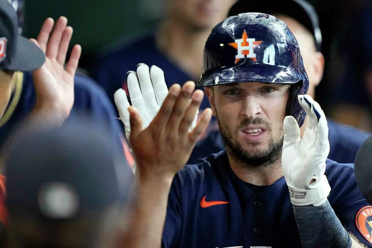 Houston Astros' Alex Bregman is congratulated in the dugout after hitting a home run against the Baltimore Orioles during the eighth inning of a baseball game Sunday, Aug. 28, 2022, in Houston.