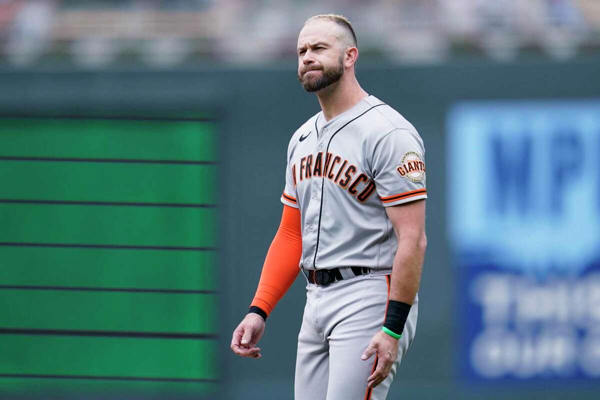 San Francisco Giants' Evan Longoria reacts after grounding out to shortstop to end the top of the first inning of a baseball game against the Minnesota Twins Sunday, Aug. 28, 2022, in Minneapolis. (AP Photo/Abbie Parr)