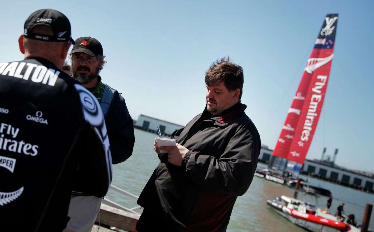 Al Saracevic, Chronicle sports editor, interviews the Emirates Team New Zealand during the 2013 America’s Cup in S.F. Most recently, he was the Examiner’s director of news and sports.