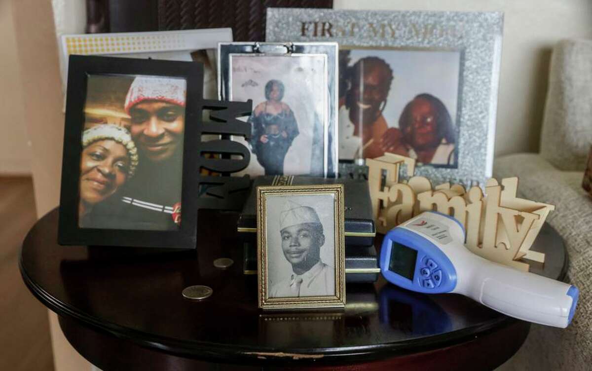 Family photos belonging to Johná Wilcoxen can be seen at his East Oakland home on Sunday, Aug. 28, 2022.