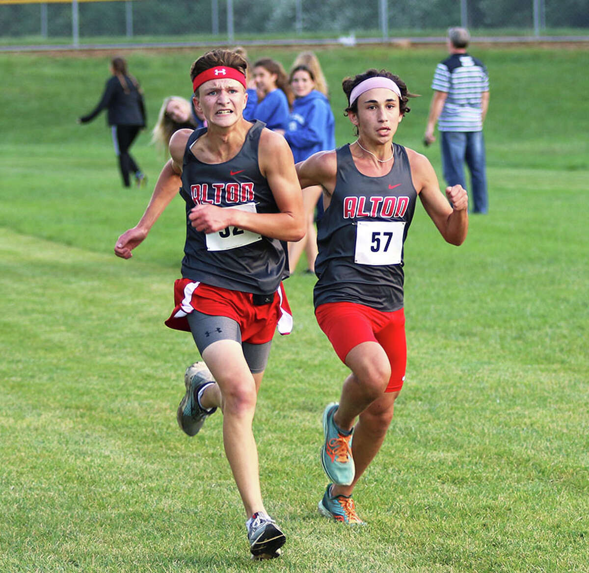 Alton's Alex Macias (right) and Victory Humphrey race to the finish in last season' Alton Invite at AHS in Godfrey. Both Redbirds rejoined teammates Saturday to run in the season-opening Mascoutah Kickoff cross country meet.