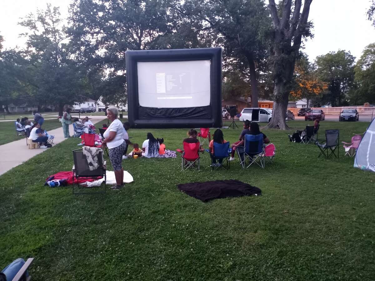 Families set up their spots before the movie starts.