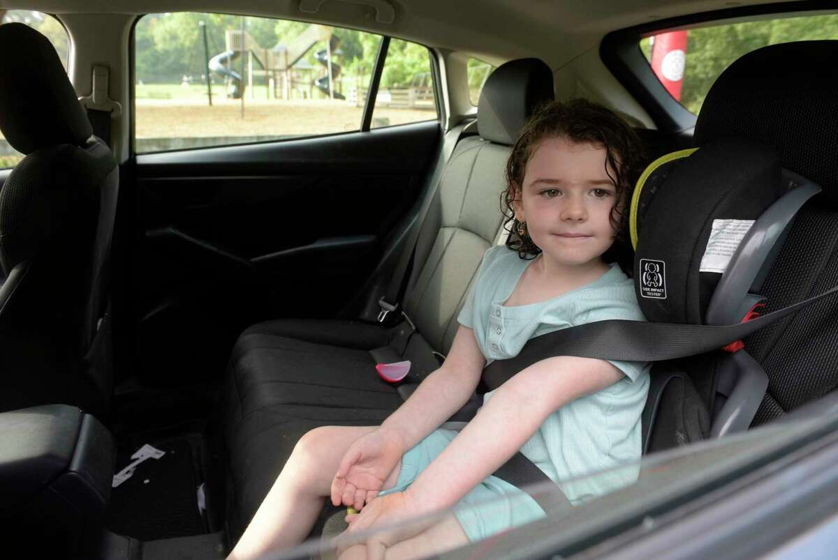 Zoe Williams, age 5, waits with her mother in their car for her first day of kindergarten at Farmingville Elementary School, Ridgefield, Conn. Monday morning, August 29, 2022.