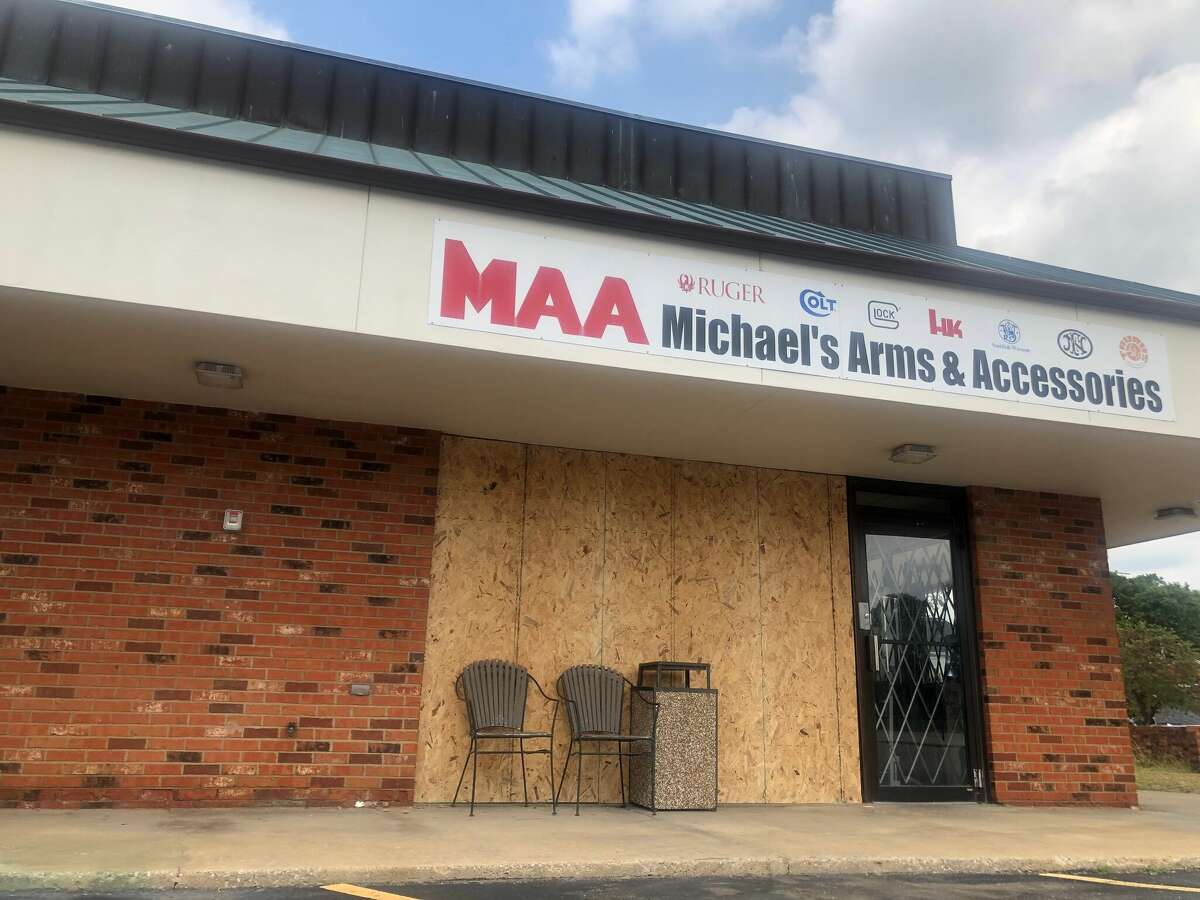 Plywood covers the area where suspects crashed a vehicle into Michael's Arms and Ammunition on Aug. 28. Edwardsville Police are still looking for the suspects whom they say were in and out of the store in less than a minute. 