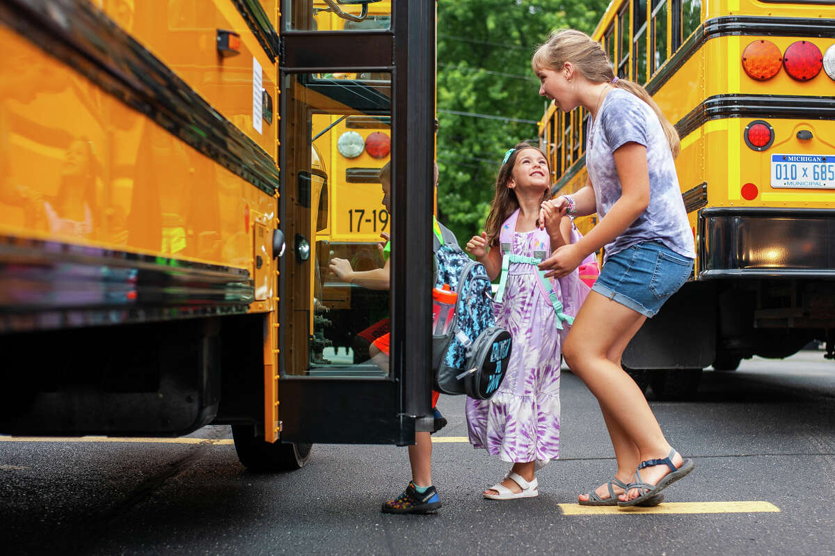 Bullock Creek Elementary students board buses following their first day of school on Aug. 29, 2022 in Midland Charter Township.
