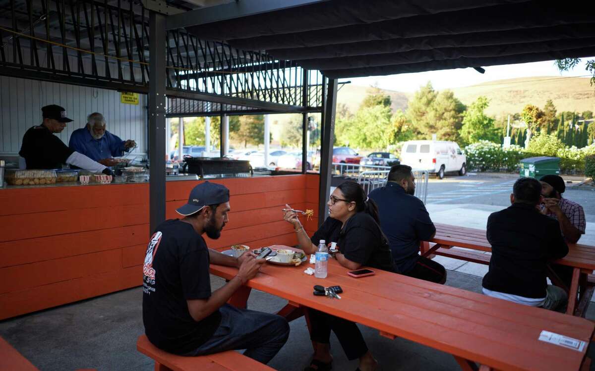 Patrons dine in the outdoor seating at Wah Jee Wah in Hayward.