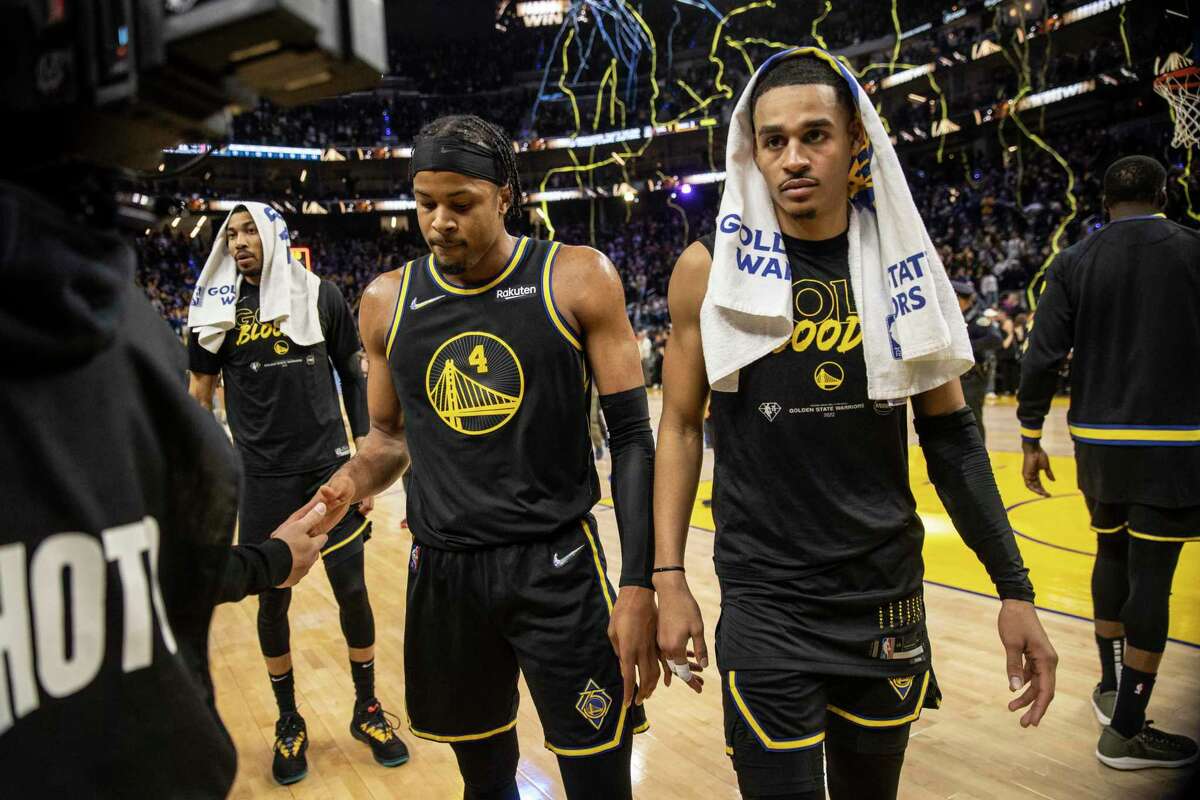 Golden State Warriors' guard Moses Moody, left, and guard Jordan Poole walk toward the locker room after defeated the Memphis Grizzlies 142-112 in Game 3 of the 2022 NBA Playoffs Western Conference Semifinals against the Memphis Grizzlies at Chase Center in San Francisco, Calif. Saturday, May 7, 2022.