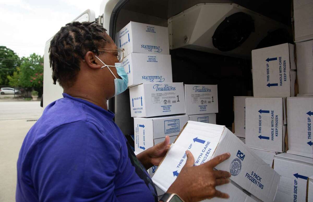 Meals On Wheels Driver Demetrias Manning moves frozen food boxes around before head out to deliver food to clients Tuesday, Aug. 23, 2022, in Houston. The service has about 5,200 clients, most of them are more than 60 years old and homebound, between Houston and Galveston.