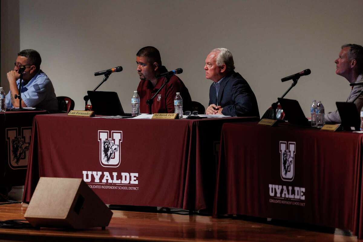 Board president Luiz Fernandez, center left, and Superintendent Hal Harrell and other Uvalde Consolidated Independent School District board members listen to public comments during a town hall at John H. Harrell Auditorium in Uvalde, Texas, Monday, Aug. 29, 2022.