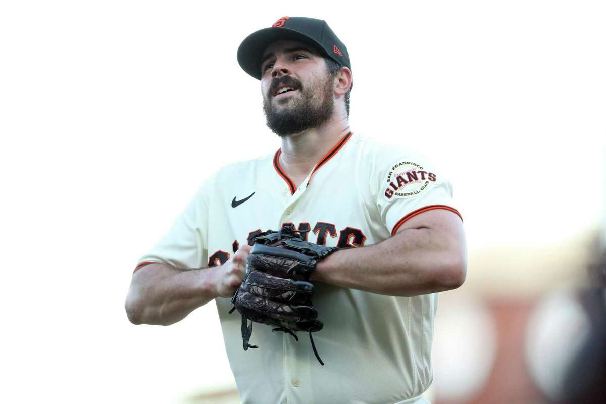 San Francisco Giants’ Carlos Rodon heads to the dugout after giving up three 1st inning runs to San Diego Padres during MLB game at Oracle Park in San Francisco, Calif., on Monday, August 29, 2022.
