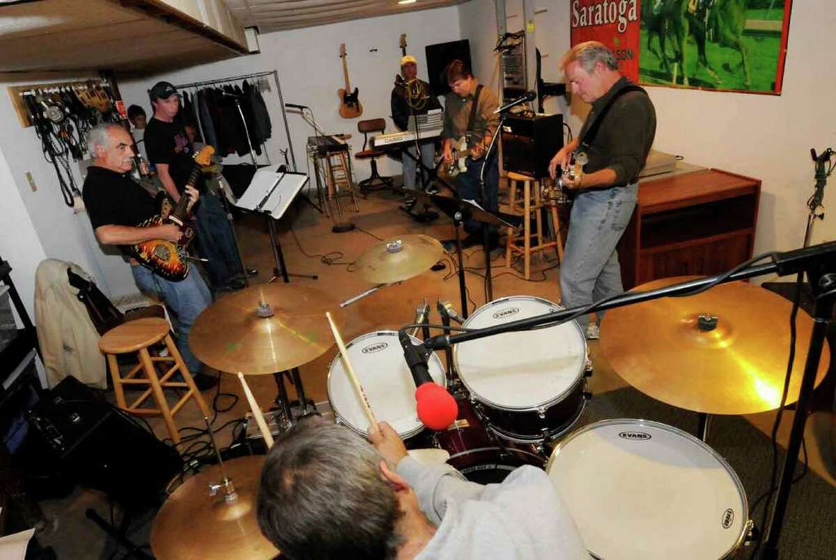 The band the Chord-A-Roys, reformed from the 1960s, practice in the basement of drummer Jim Rocco's Guilderland home for an upcoming class of 1970 dance party at the All Saints Parish Center in Albany 10/06/2010. (Michael P. Farrell / Times Union)