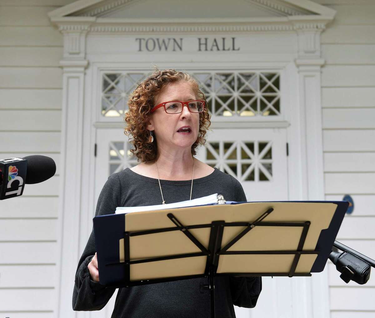 Erin Boggs, executive director of Open Communities Alliance, speaks in front of Woodbridge Town Hall on September 29, 2020 concerning the organization's challenge to the town's zoning laws restricting multi-family developments of 3 or more units.