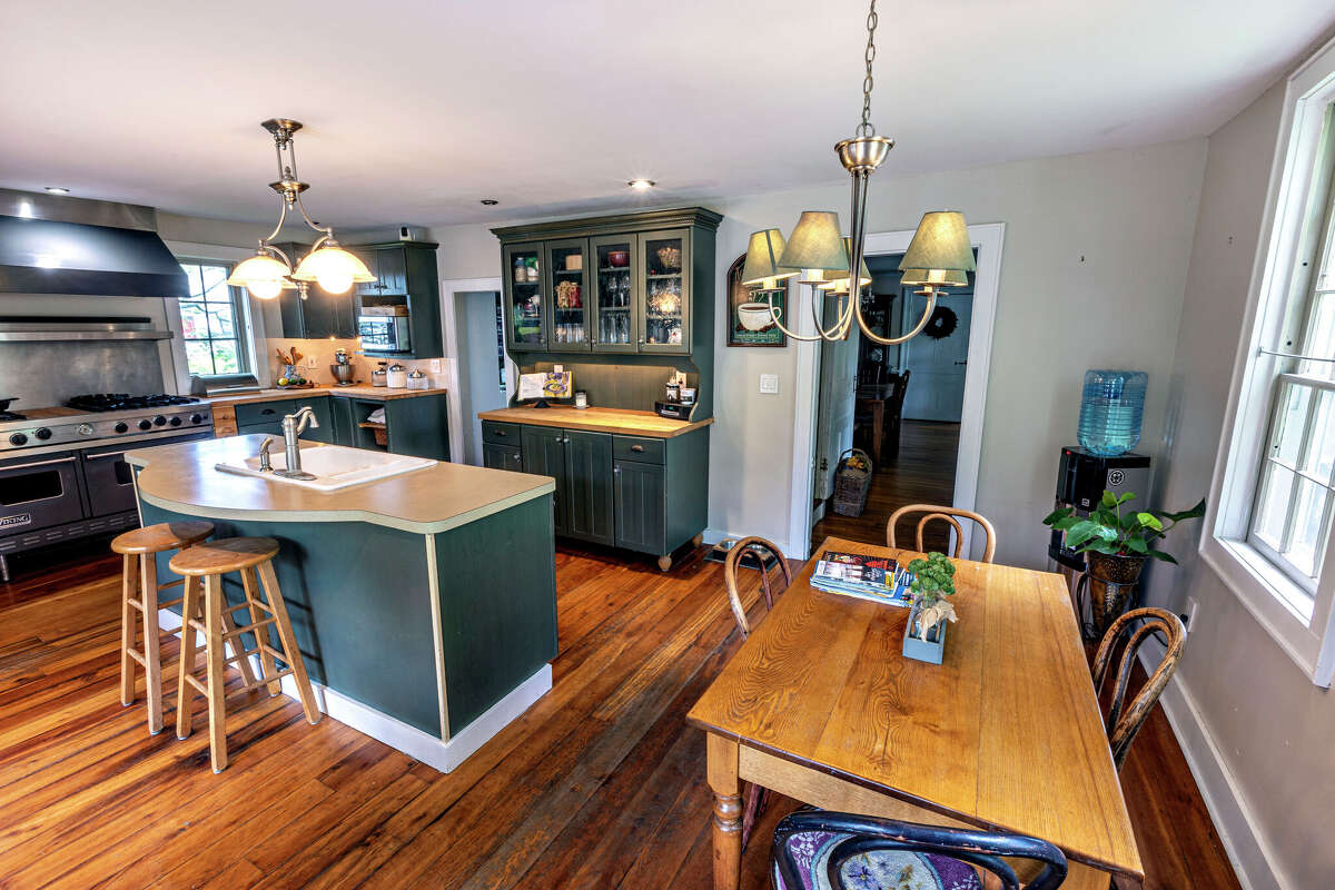 Delanson Colonial home for sale under 500,000 has five bedrooms, pool