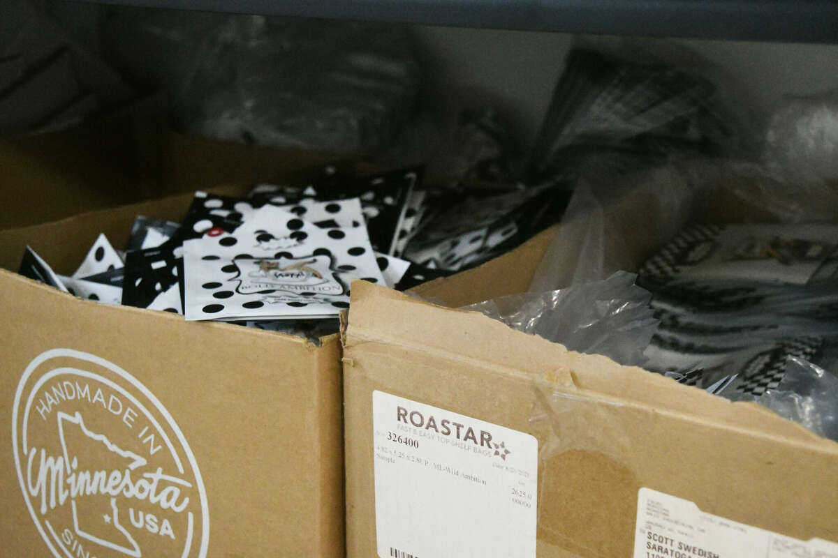 Packages of single-serve Moxxi Coffee sit in the Moxxi Headquarters in Stillwater, N.Y. The polka dots and pinups are signature design elements for the Moxxi brand. (Katherine Kiessling/Times Union)