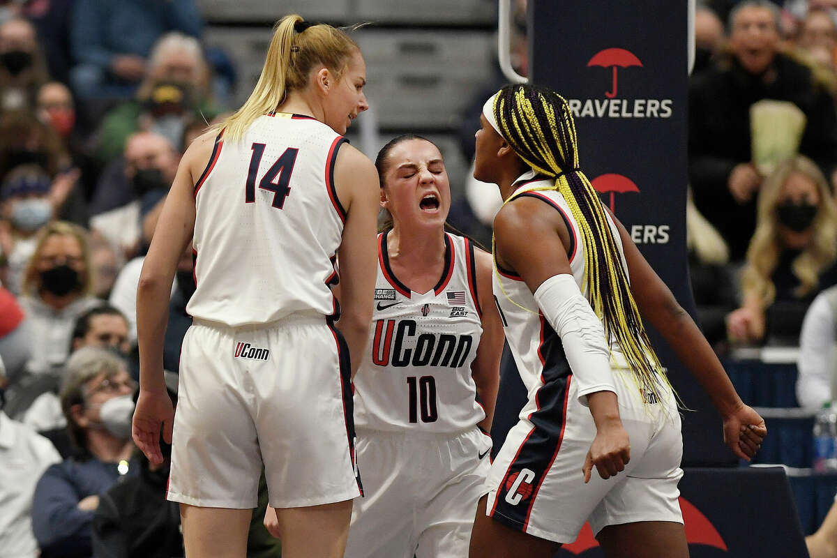 Connecticut's Dorka JuhÃ¡sz, left, Nika MÃ¼hl, center, and Aaliyah Edwards react in the first half of an NCAA college basketball game against Tennessee, Sunday, Feb. 6, 2022, in Hartford, Conn. (AP Photo/Jessica Hill)