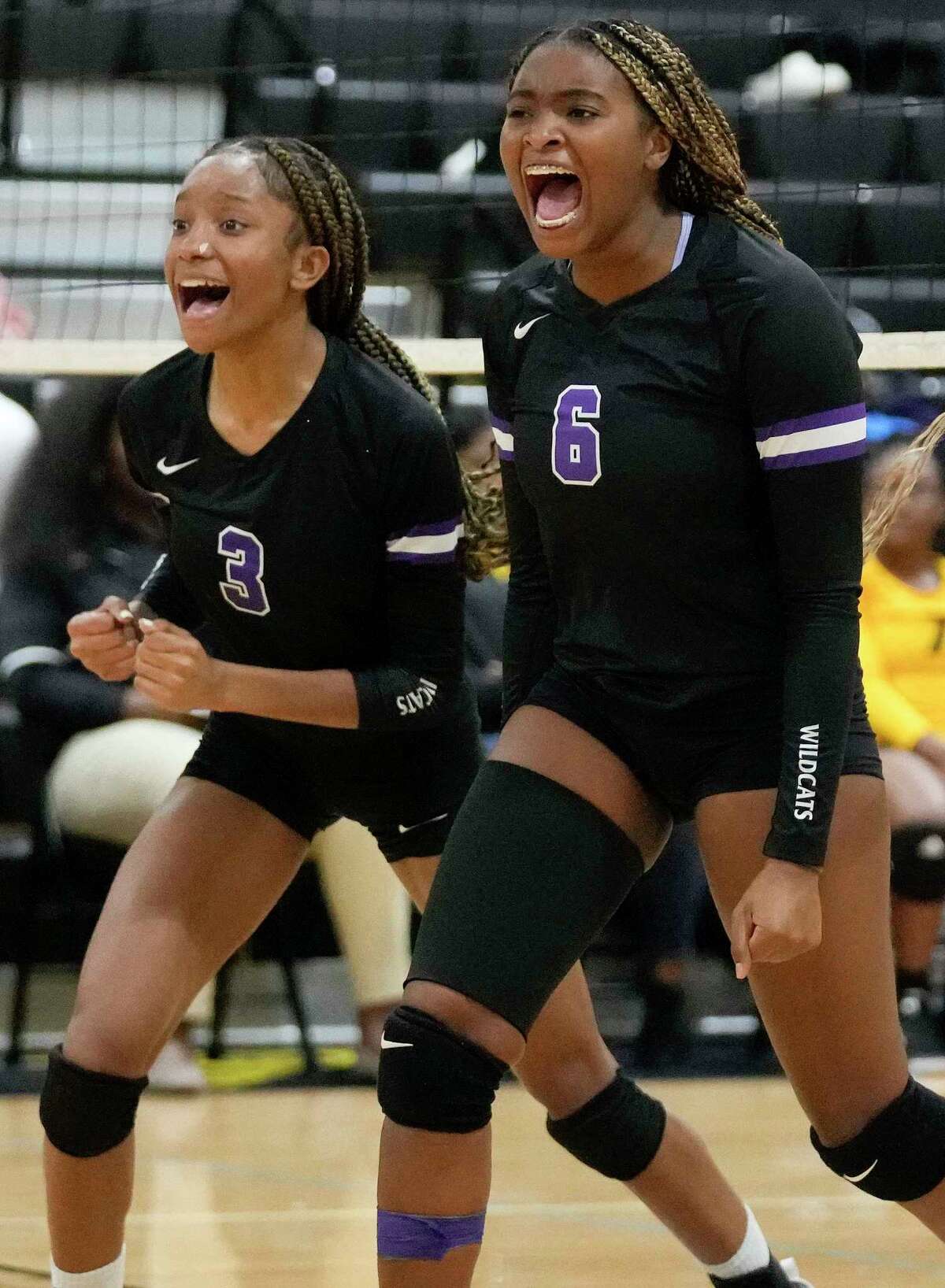 Humble's Jada James (6) celebrates her point with Trabrece Marbley during a high school volleyball match against Eisenhower, Tuesday, Aug. 23, 2022, in Houston.
