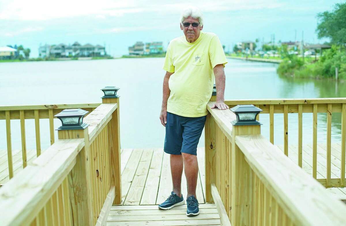 Liver transplant recipient Lonnie Dunlap, 65, on his boat dock at his home on Wednesday, Aug. 24, 2022 in Seabrook.
