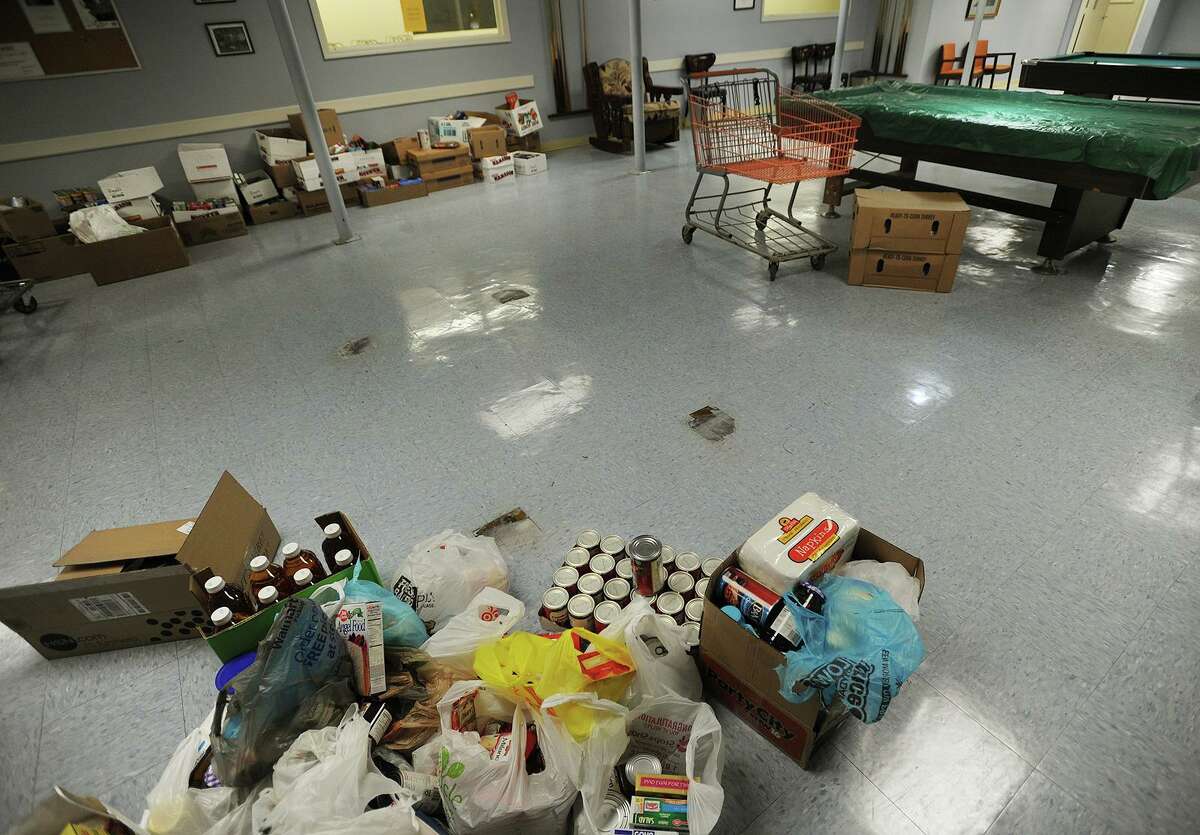 Holiday food donations wait to be shelved at the Trumbull Food Pantry at the Trumbull Senior Center on Monday, November 21, 2016.