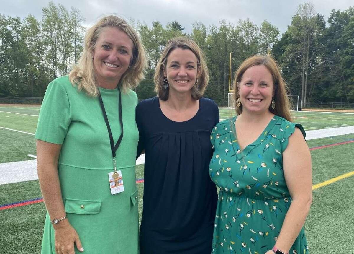 Shelton High Principal Kathy Riddle, right, with the past two Shelton Teacher of the Year winners, Catherine Deitelbaum (2022), center, and Catherine Burgholzer (2021) at the Shelton Public School’s annual convocation Aug. 30 at Finn Stadium. Shelton schools’ first day is Sept. 6.