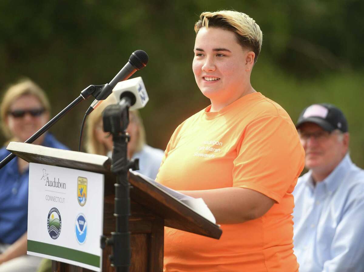 Saltmarsh Steward Amelis Medina, 14, of Stratford, addresses the opening ceremony of the 34 acre Great Meadows Marsh restoration in Stratford, Conn. on Tuesday, August 30, 2022. Twelve paid seasonal student stewards planted over 155,000 native coastal plants to the site with the help of three crew leaders and over 150 volunteers.